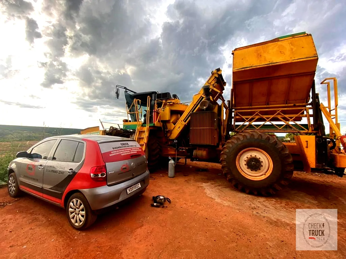 Atendimento em campo junto a um distribuidor de calcário, em área de lavoura